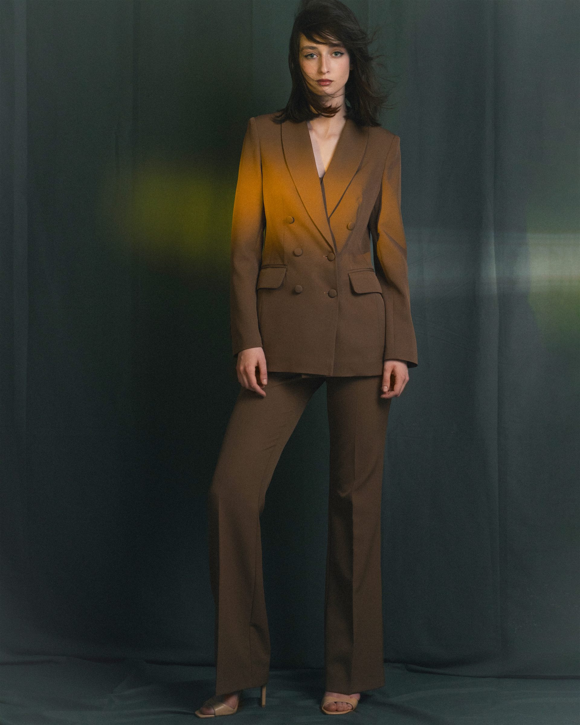 Arina Mura, editorial portrait in tailored suit