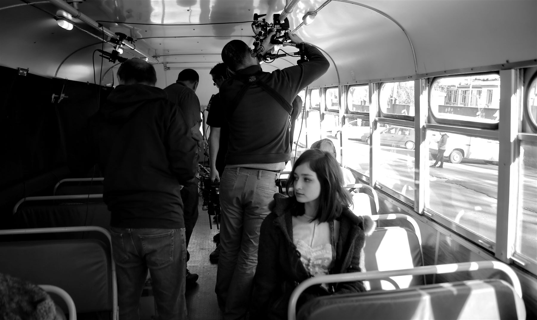 Behind the scenes on the set of Transit Times, film crew aboard a bus