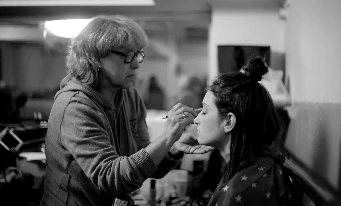 Arina Mura in makeup chair during Transit Times production