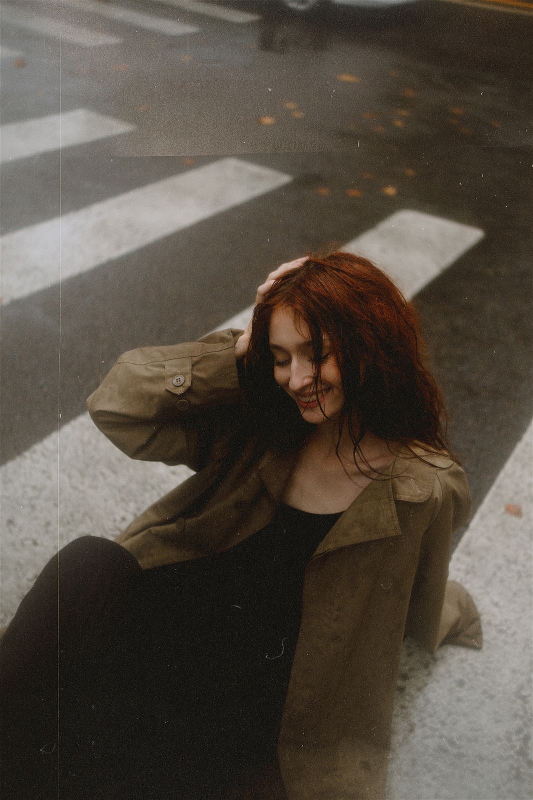 Candid lifestyle photo of Arina Mura at a crosswalk