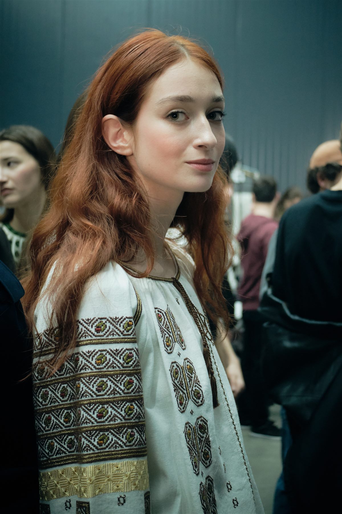 Arina Mura backstage in an embroidered traditional blouse