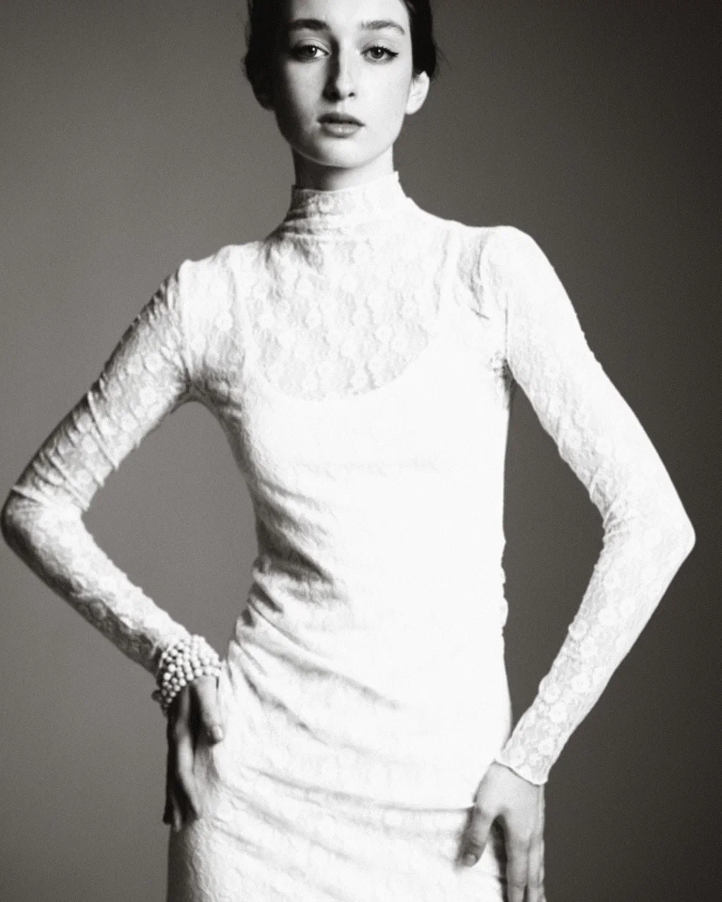 Arina Mura studio editorial portrait in white lace turtleneck