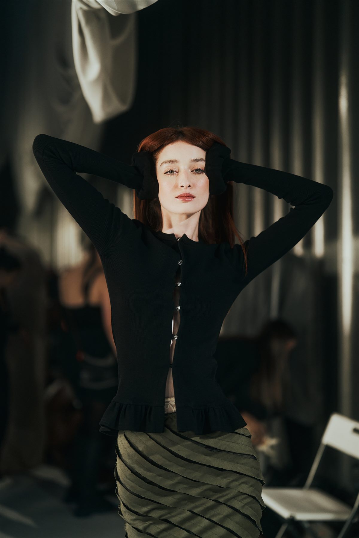 Arina Mura close editorial portrait, dramatic profile light