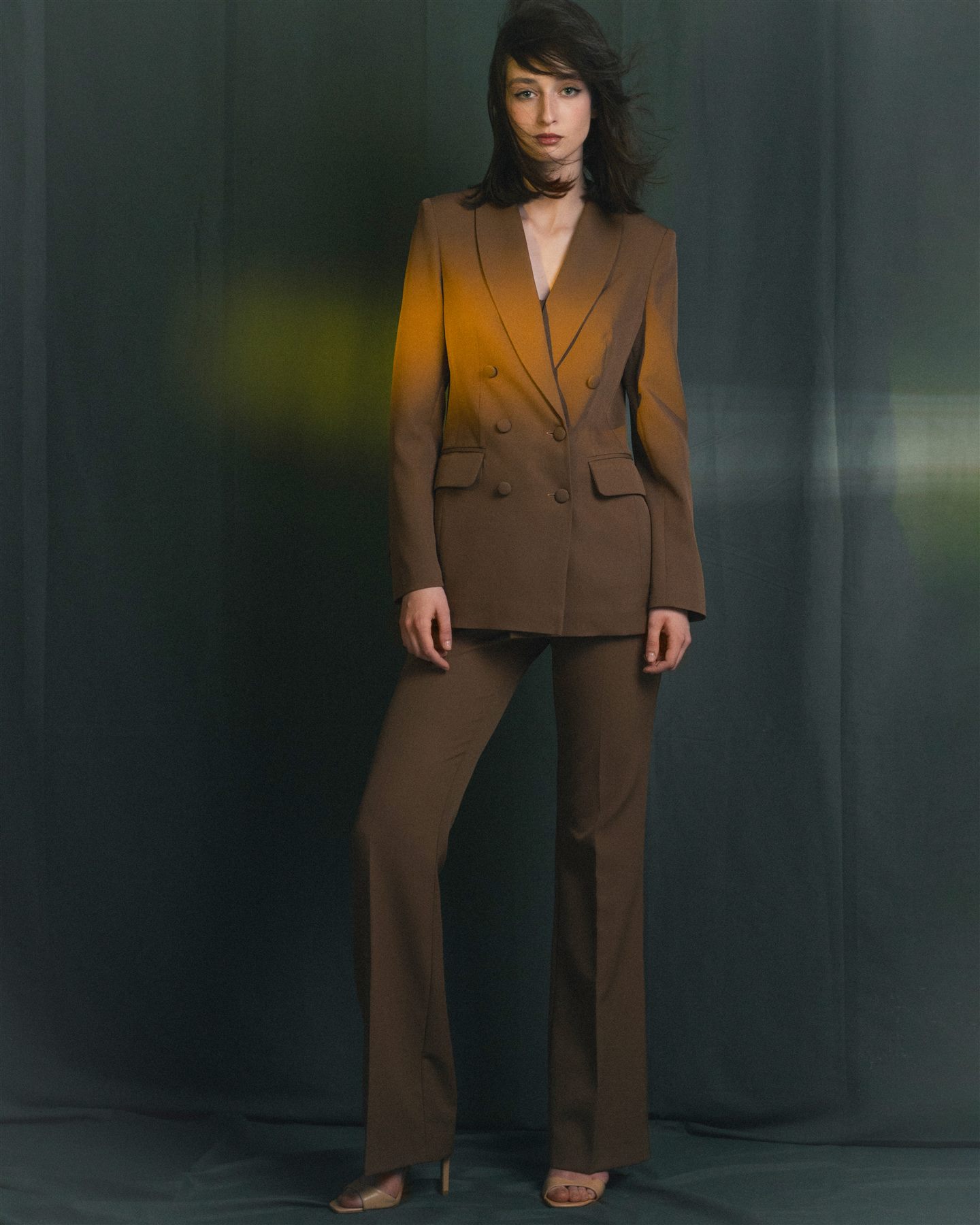 Arina Mura editorial portrait in a tailored suit